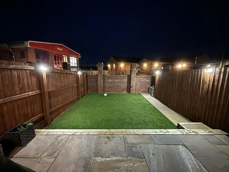 Garden lit up at night, from Joanna's TrustATrader review